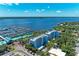 Stunning aerial view of the waterfront condo buildings and marina on a sunny day, with the bay in the distance at 1000 Riverside Dr # B202, Palmetto, FL 34221
