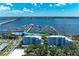 Beautiful aerial view of the condos and marina, highlighting its waterfront location and boat access on a sunny day at 1000 Riverside Dr # B202, Palmetto, FL 34221