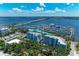 A scenic aerial view featuring the marina, a bridge, open water, and waterfront condominiums at 1000 Riverside Dr # B202, Palmetto, FL 34221