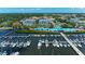 Picturesque aerial view showcasing a marina, luxury condominiums, and a vibrant cityscape at 1000 Riverside Dr # B202, Palmetto, FL 34221