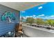 Cozy balcony with comfortable seating, offering serene views of the boats and marina, creating a perfect retreat at 1000 Riverside Dr # B202, Palmetto, FL 34221