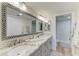 Bathroom with a double vanity, large mirror, and modern finishes at 1000 Riverside Dr # B202, Palmetto, FL 34221