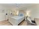 Bright bedroom with a wooden floor, a ceiling fan, and white furniture, creating a calm, inviting space at 1000 Riverside Dr # B202, Palmetto, FL 34221