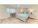 Bright bedroom featuring a comfortable bed, desk, and ceiling fan at 1000 Riverside Dr # B202, Palmetto, FL 34221