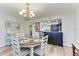 Dining room near kitchen with table set for four, featuring light and airy decor at 1000 Riverside Dr # B202, Palmetto, FL 34221