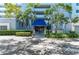 Exterior entrance with blue awning and well maintained landscaping at 1000 Riverside Dr # B202, Palmetto, FL 34221