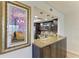Stylish kitchen with granite counter, pendant lights, stainless appliances, and open to dining area at 1000 Riverside Dr # B202, Palmetto, FL 34221
