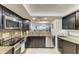 Spacious kitchen with stainless steel appliances, granite countertops, and ample cabinet space at 1000 Riverside Dr # B202, Palmetto, FL 34221