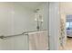 Modern shower with glass doors, a showerhead, and a towel rack at 1000 Riverside Dr # B202, Palmetto, FL 34221