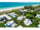 A high angle of a neighborhood near the beach with blue water at 103 Park Ave, Anna Maria, FL 34216