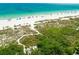 Scenic aerial view of a pristine beach with clear blue water and white sand at 103 Park Ave, Anna Maria, FL 34216