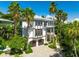 Beautiful multi-story home surrounded by lush greenery, offering privacy at 103 Park Ave, Anna Maria, FL 34216