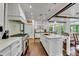 Gourmet kitchen features marble counters, custom cabinets, hardwood floors, high-end appliances, and an island at 103 Park Ave, Anna Maria, FL 34216