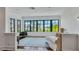Cozy sitting room features hardwood floors, large windows, and comfortable seating for relaxation at 103 Park Ave, Anna Maria, FL 34216