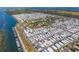 Expansive aerial shot showcases the community's layout, abundant housing, and waterfront location at 10315 Cortez W Rd # 24-5, Bradenton, FL 34210