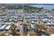 Community aerial view shows street, housing, and landscaping at 10315 Cortez W Rd # 24-5, Bradenton, FL 34210