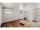 An empty bedroom with wood paneling, a window, and built-in shelving in need of some repairs at 10315 Cortez W Rd # 24-5, Bradenton, FL 34210