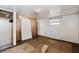 Vacant bedroom showcasing window, paneled walls, closet, and flooring in need of renovation at 10315 Cortez W Rd # 24-5, Bradenton, FL 34210
