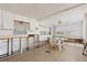 Partially renovated dining area with new flooring and a breakfast nook at 10315 Cortez W Rd # 24-5, Bradenton, FL 34210