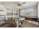 Bright dining room with windows and exterior view at 10315 Cortez W Rd # 24-5, Bradenton, FL 34210