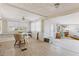 Bright dining room features new flooring and a view to an exterior porch at 10315 Cortez W Rd # 24-5, Bradenton, FL 34210