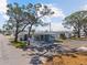 A charming home with covered front porch, surrounded by mature trees and a well maintained yard at 10315 Cortez W Rd # 24-5, Bradenton, FL 34210
