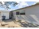 The rear exterior of the home featuring a small patio at 10315 Cortez W Rd # 24-5, Bradenton, FL 34210