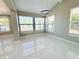 Bright dining area with vaulted ceiling, recessed lights, and three large windows at 1142 Newhope Rd, Spring Hill, FL 34606