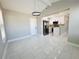 Dining area view into kitchen with stainless steel appliances and white cabinets at 1142 Newhope Rd, Spring Hill, FL 34606