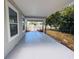 Covered patio offers a serene outdoor space, great for relaxation and entertaining with backyard view at 1142 Newhope Rd, Spring Hill, FL 34606