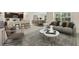 Open-concept living room with seamless transition to the dining area and kitchen at 12112 Kingsley Trl, Parrish, FL 34219