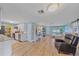The living room offers an open floor plan with tile floors, bright walls and lots of natural light at 130 E Seminole Dr, Venice, FL 34293