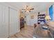 Office space with wood tile flooring, ceiling fan, closet and wood desk at 130 E Seminole Dr, Venice, FL 34293