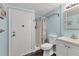 Cozy bathroom with shower, white toilet and vanity, and blue walls at 1307 41St E Ave, Ellenton, FL 34222