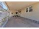 Spacious carport area offering covered parking and an outdoor seating space at 1307 41St E Ave, Ellenton, FL 34222