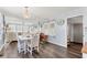 Charming dining area with seating for four, light blue walls, and light-colored wood-look flooring at 1307 41St E Ave, Ellenton, FL 34222