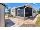 Home exterior featuring a paved patio with a screen enclosed porch at 1307 41St E Ave, Ellenton, FL 34222