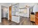 Functional kitchen featuring white cabinetry and sleek hardwood floors, perfect for cooking at 1307 41St E Ave, Ellenton, FL 34222