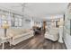 Open-concept living room with hardwood floors and a seamless flow into the kitchen at 1307 41St E Ave, Ellenton, FL 34222