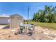 Home's patio area featuring a storage shed and outdoor seating at 1307 41St E Ave, Ellenton, FL 34222