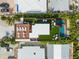 Aerial view of luxurious rooftop featuring deck, pool, and ample lounge seating, perfect for outdoor living at 135 Grant Dr, Sarasota, FL 34236
