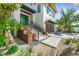 Modern home exterior with beautiful landscaping, planters, and decorative rock at 135 Grant Dr, Sarasota, FL 34236