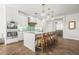 Well-appointed kitchen featuring a large island, bar seating, and modern appliances perfect for entertaining at 135 Grant Dr, Sarasota, FL 34236