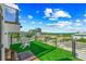 Enjoy the stunning rooftop deck with artificial turf and city views at 135 Grant Dr, Sarasota, FL 34236