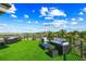 Lounge on the rooftop deck with panoramic views and comfortable seating at 135 Grant Dr, Sarasota, FL 34236