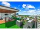 Entertain on the large rooftop deck with dining and multiple seating areas at 135 Grant Dr, Sarasota, FL 34236