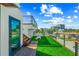 Relax on the rooftop deck with artificial turf and modern railings at 135 Grant Dr, Sarasota, FL 34236