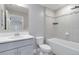 Stylish bathroom featuring a modern vanity, toilet, and bathtub with tiled walls and decorative accent tiles at 14914 15Th E St, Parrish, FL 34219