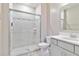 Bathroom featuring a glass-enclosed shower, white cabinets, and tile flooring at 14914 15Th E St, Parrish, FL 34219