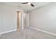 Cozy bedroom with carpet, doors, and a ceiling fan at 14914 15Th E St, Parrish, FL 34219